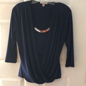 Navy top with gold accent, ruffled bodice